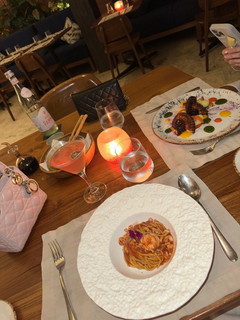 Cozy winter dinner with pasta and candles, embracing slow evenings | THE DAILY HAPPINESS