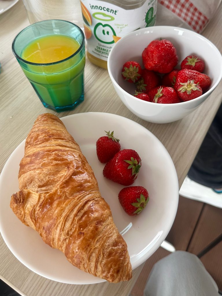 Slow breakfast moment with fresh fruit and coffee, embracing mornings that start with intention.